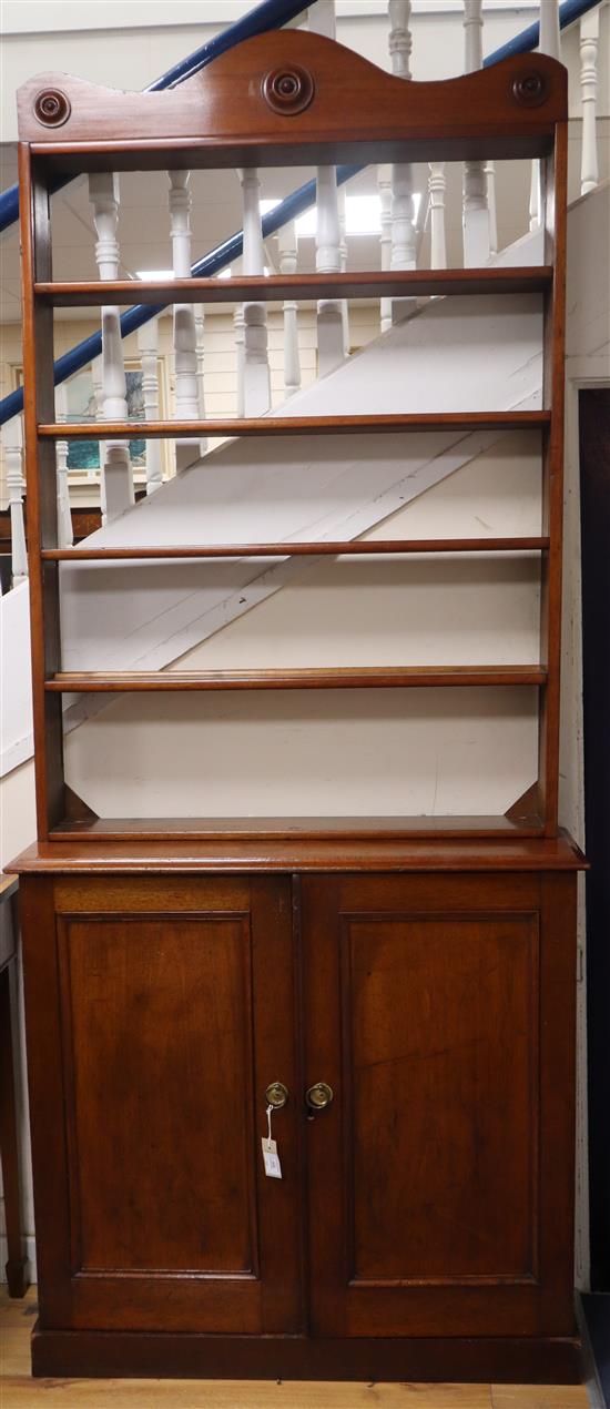 A Victorian mahogany cupboard with associated plate rack W.102cm